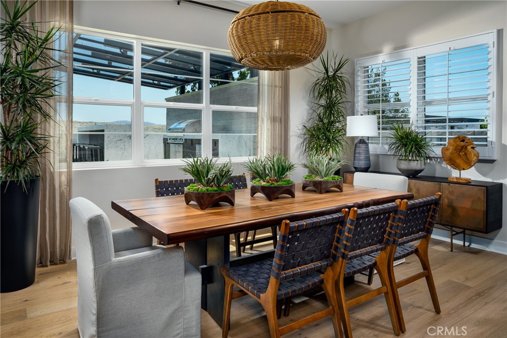 27534 Elderberry Drive Valencia, CA 91381 - Photo 7 of 17 a table and chairs in front of a house