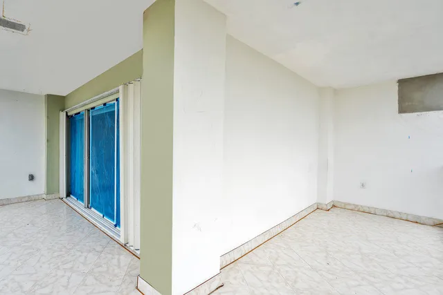 a view of a pool with a patio