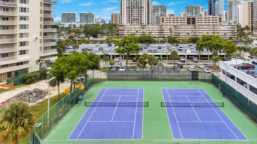 500 Bayview Drive, Unit 1521 Sunny Isles Beach, FL 33160 - Photo 26 of 31 a building view with swimming pool and lawn chairs