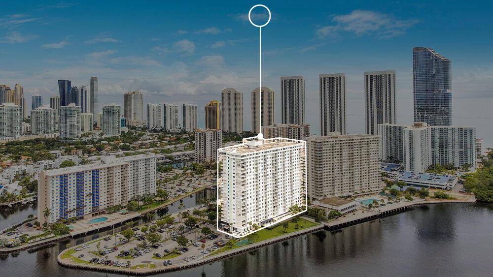 500 Bayview Drive, Unit 1521 Sunny Isles Beach, FL 33160 - Photo 30 of 31 a room with water heater and wooden cabinets
