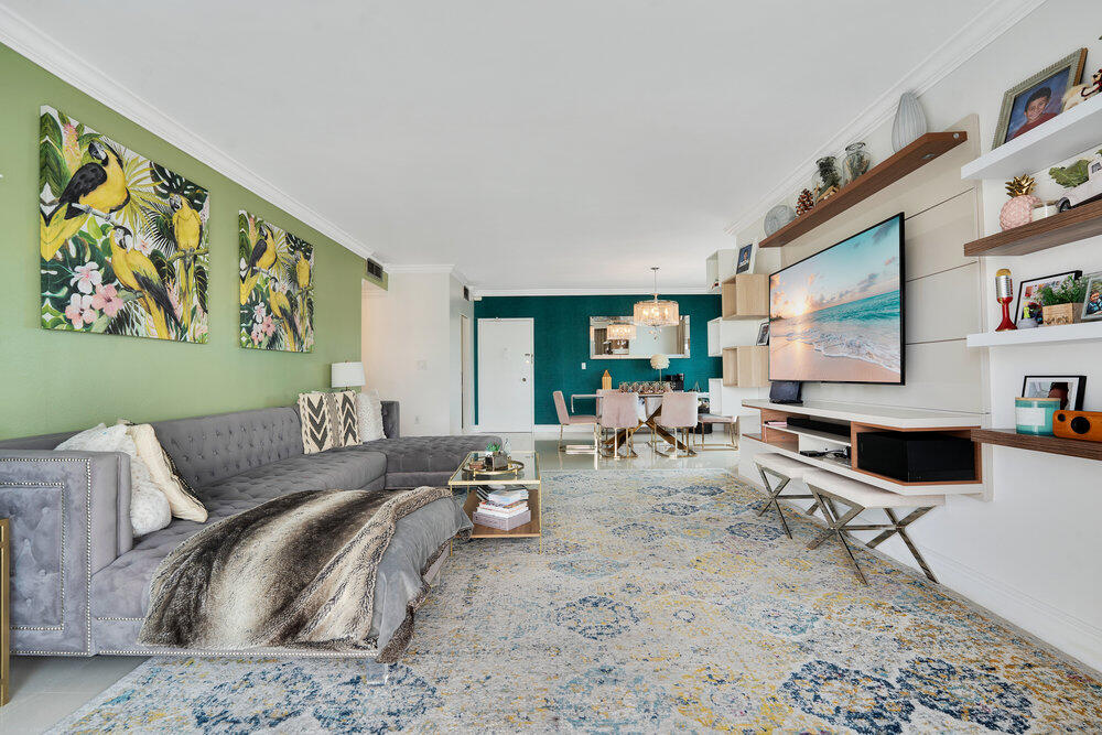 500 Bayview Drive, Unit 1521 Sunny Isles Beach, FL 33160 - Photo 4 of 31 a living room with furniture and a flat screen tv