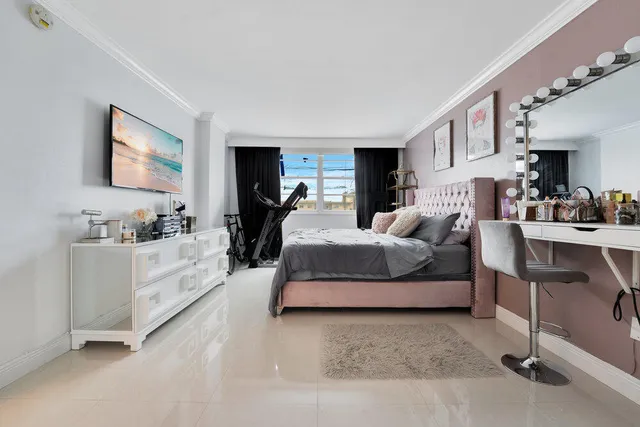 a living room with furniture and a kitchen