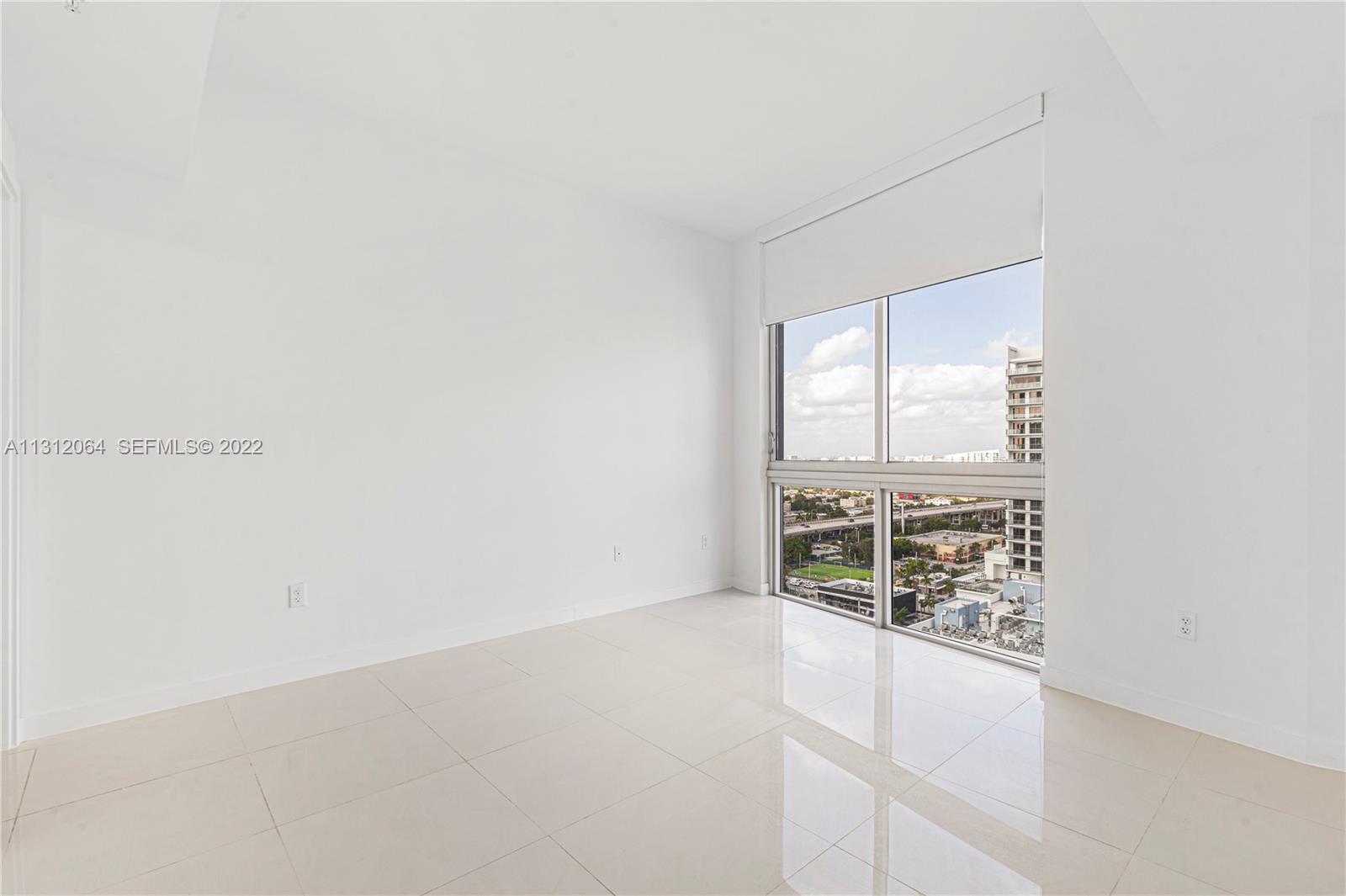 1010 Southwest 2nd Avenue, Unit 2004 Miami, FL 33130 - Photo 6 of 19 a view of an empty room with a window