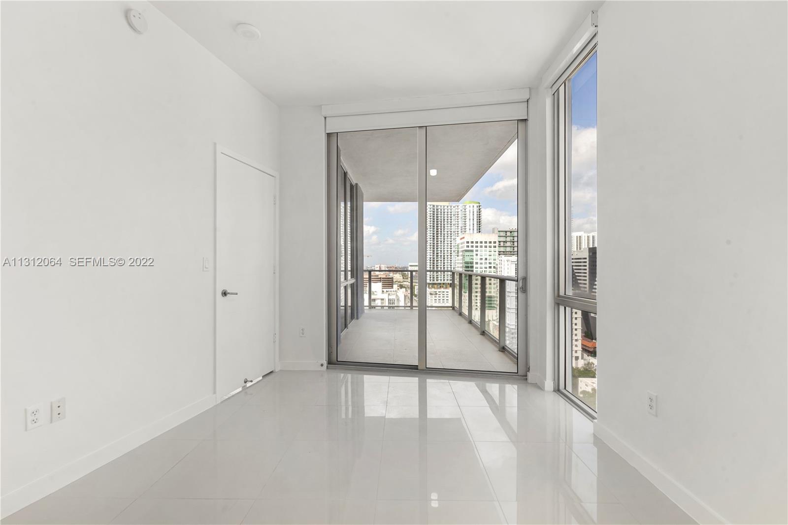 1010 Southwest 2nd Avenue, Unit 2004 Miami, FL 33130 - Photo 7 of 19 a view of an entryway with wooden floor