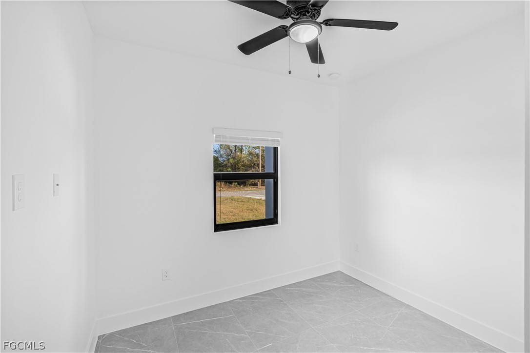 745 Roma Avenue South Lehigh Acres, FL 33974 - Photo 23 of 40 an empty room with a window