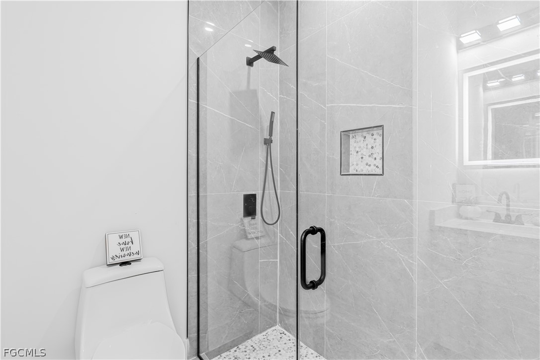 745 Roma Avenue South Lehigh Acres, FL 33974 - Photo 27 of 40 a bathroom with a shower