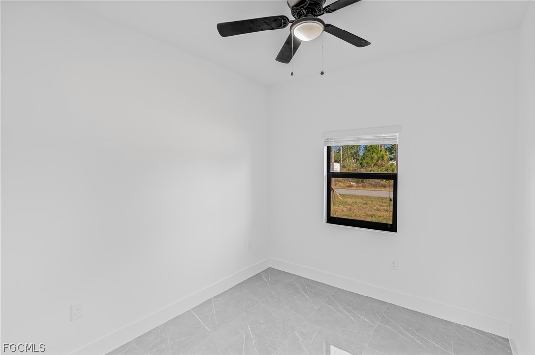 745 Roma Avenue South Lehigh Acres, FL 33974 - Photo 28 of 40 an empty room with a window