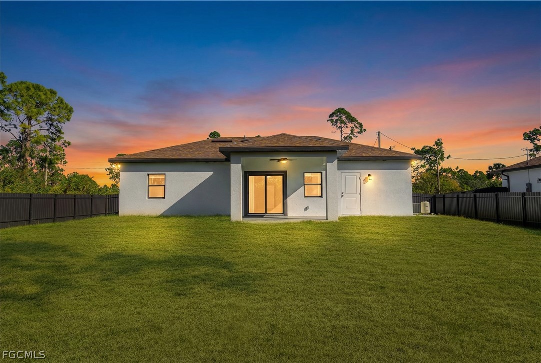 745 Roma Avenue South Lehigh Acres, FL 33974 - Photo 37 of 40 a view of a big yard with a house