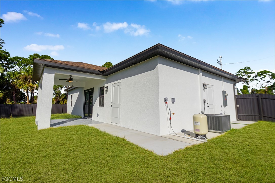 745 Roma Avenue South Lehigh Acres, FL 33974 - Photo 40 of 40 a front view of a house with a yard