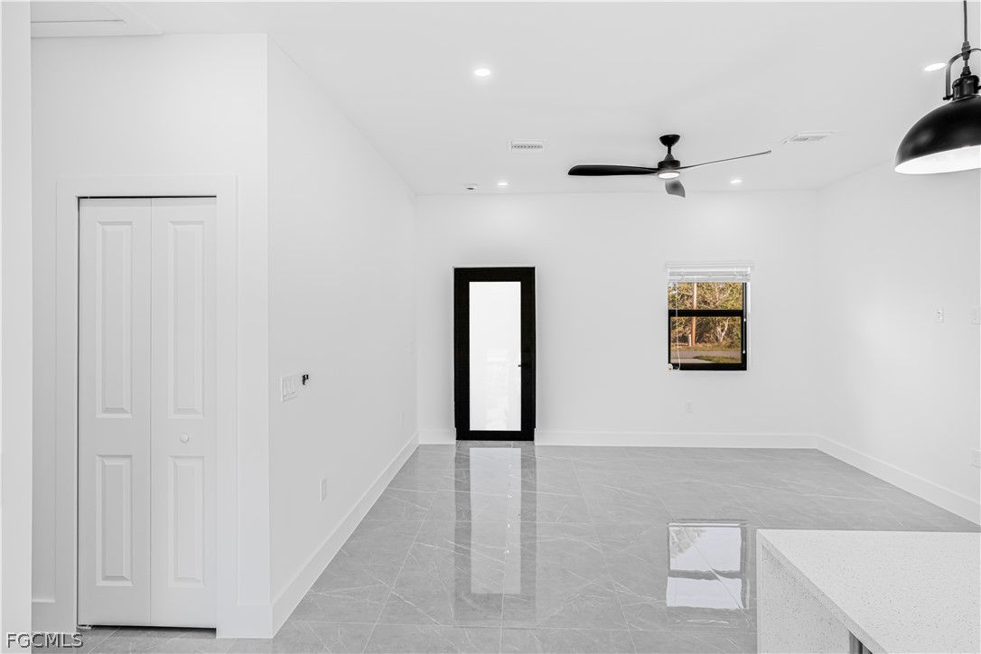 745 Roma Avenue South Lehigh Acres, FL 33974 - Photo 8 of 40 an empty room with closet and windows
