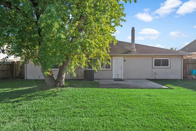 a view of a backyard of the house