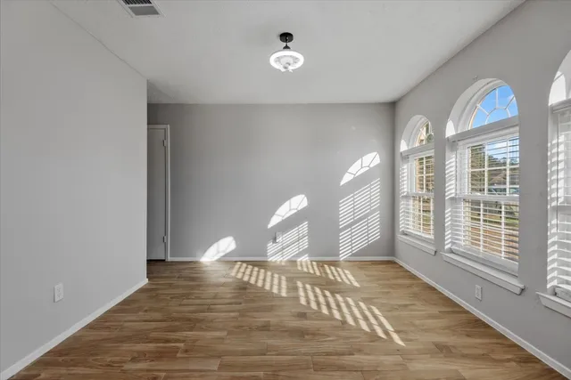 a view of an empty room with a window