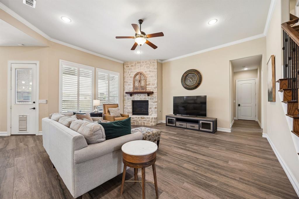 948 Holt Lane Allen, TX 75013 - Photo 12 of 40 Living room with cozy fireplace and backyard views