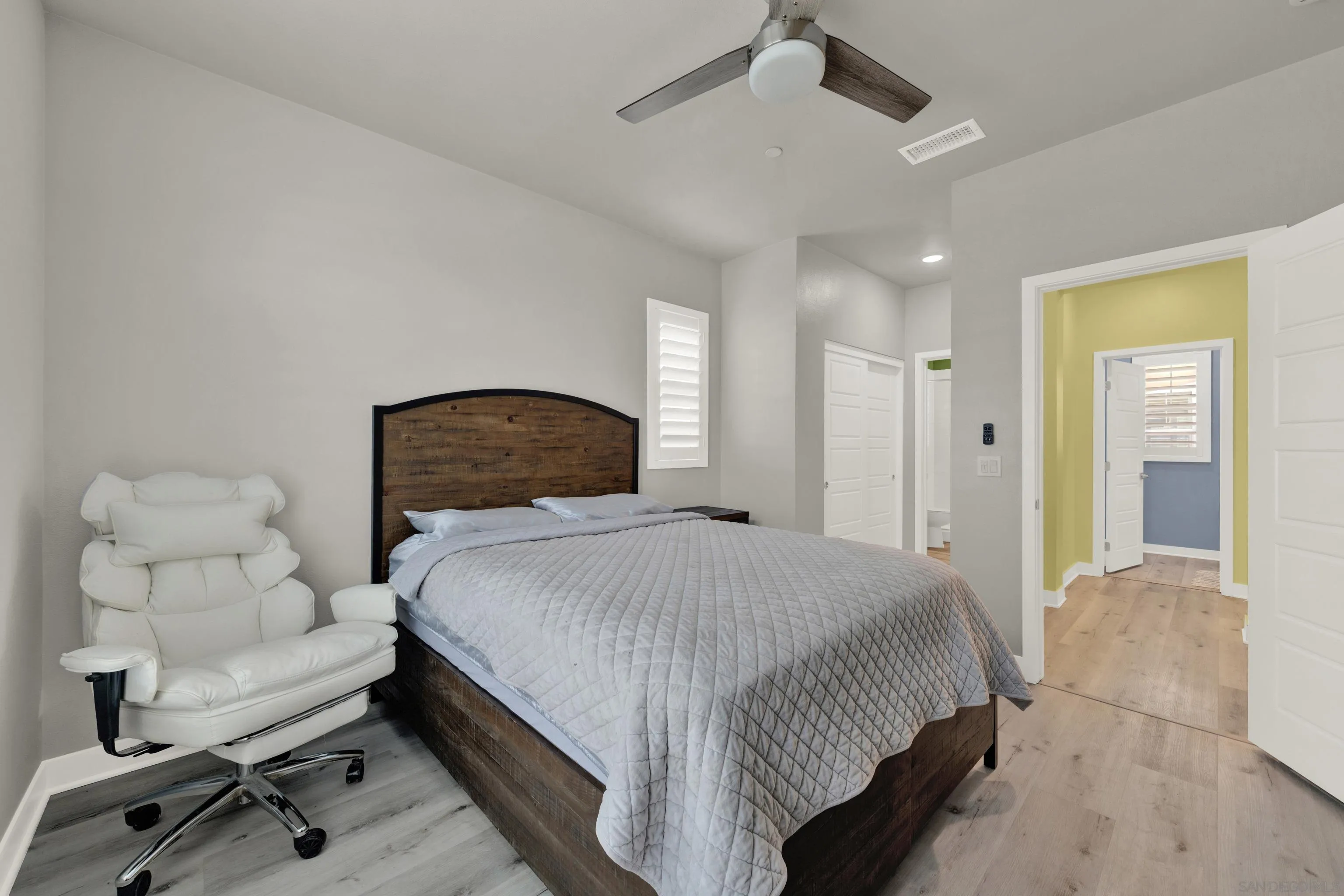 9108 West Bluff Place Santee, CA 92071 - Photo 17 of 72 a bedroom with a bed and a chair