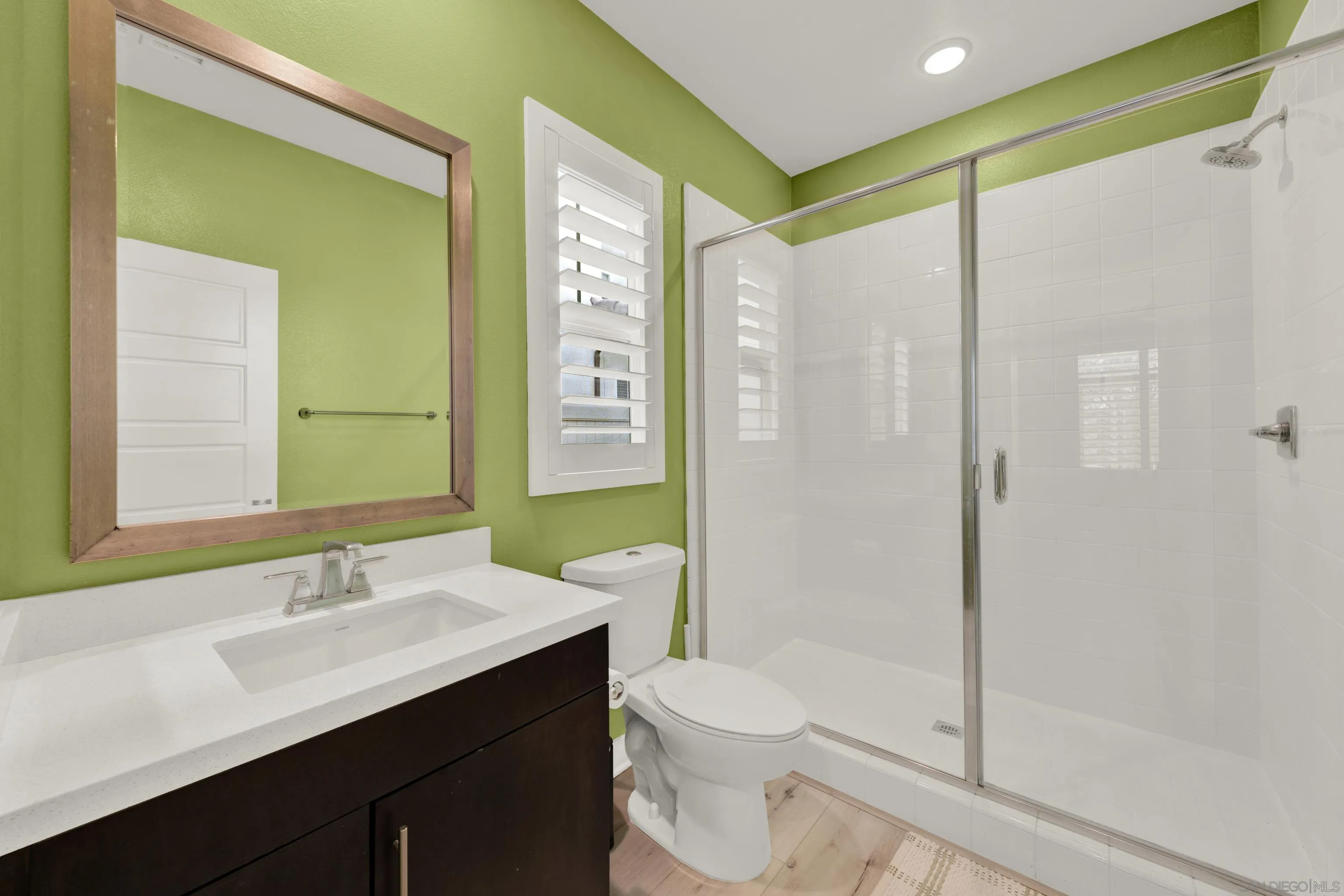 9108 West Bluff Place Santee, CA 92071 - Photo 18 of 72 a bathroom with a sink and a mirror