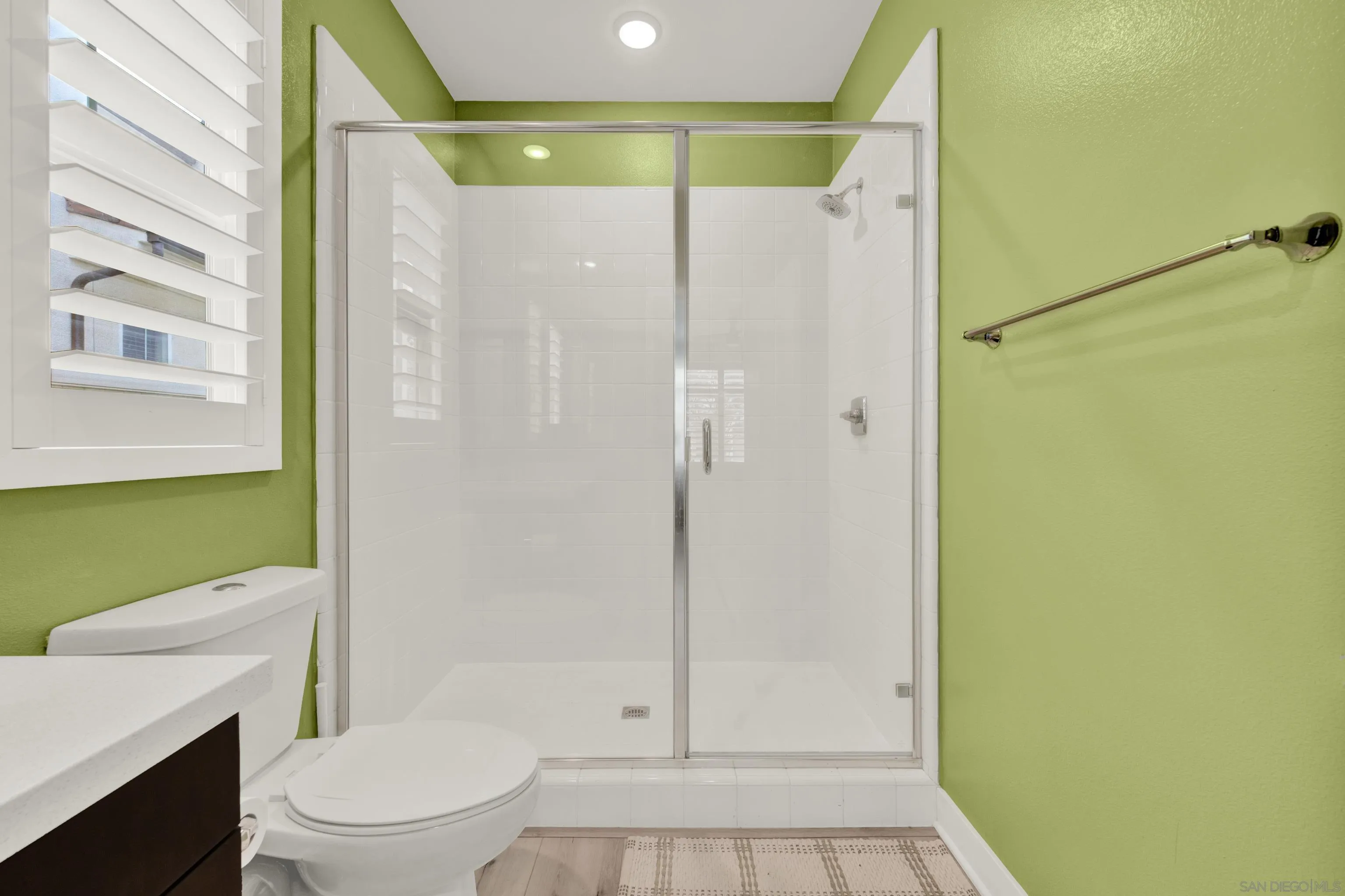 9108 West Bluff Place Santee, CA 92071 - Photo 19 of 72 a bathroom with a shower a toilet and a sink