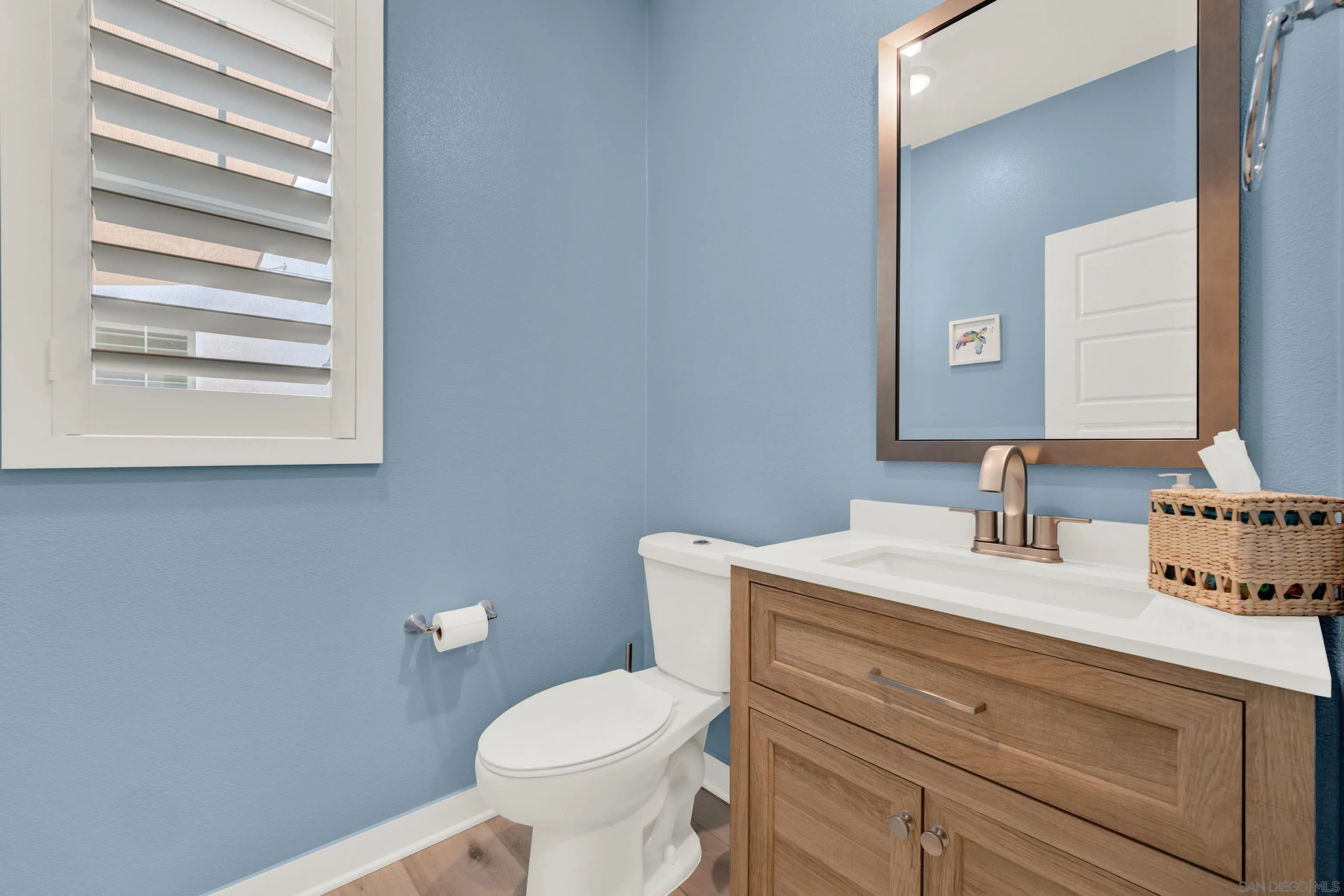 9108 West Bluff Place Santee, CA 92071 - Photo 21 of 72 a bathroom with a toilet sink and mirror