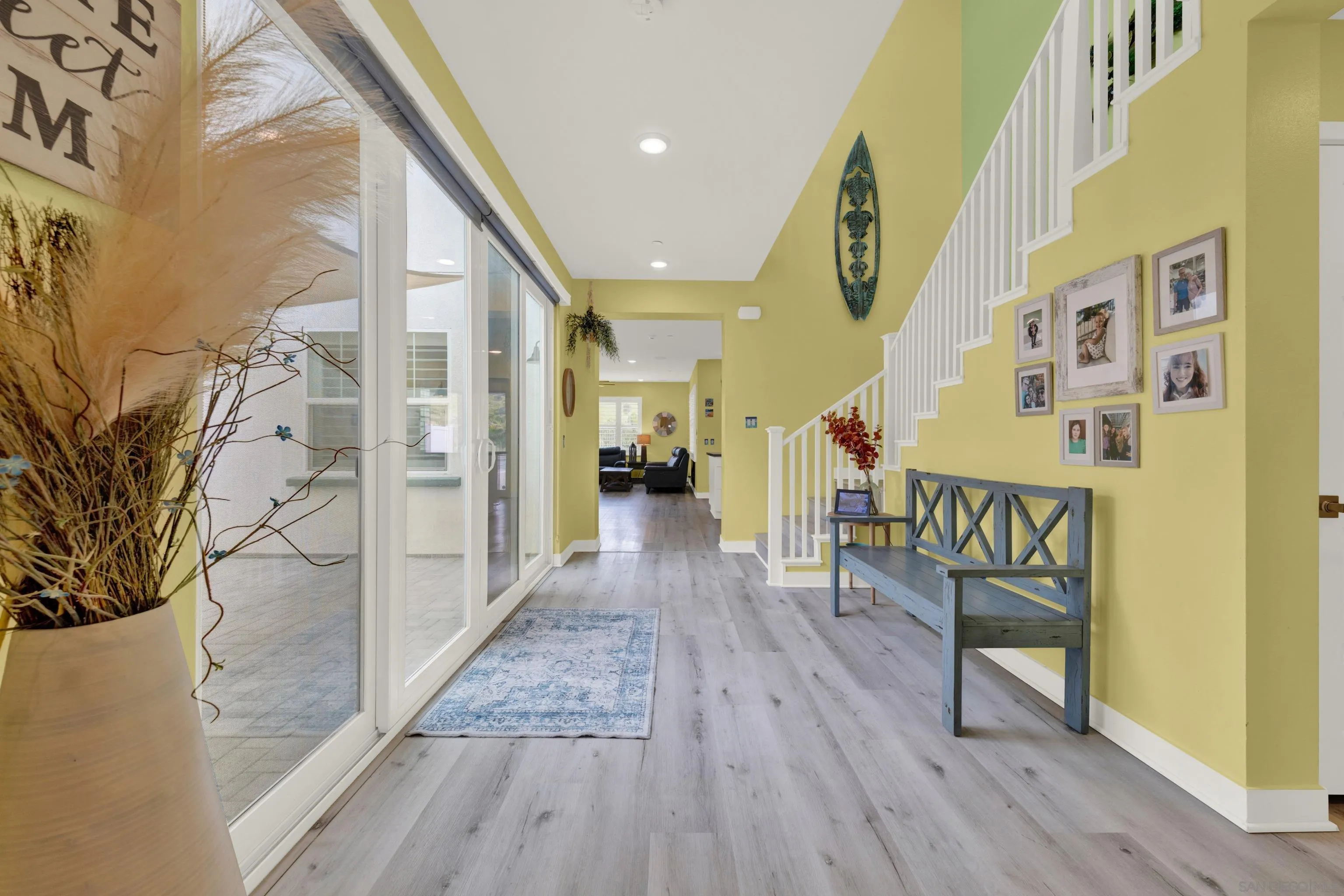 9108 West Bluff Place Santee, CA 92071 - Photo 22 of 72 a view of a hallway with wooden floor and staircase