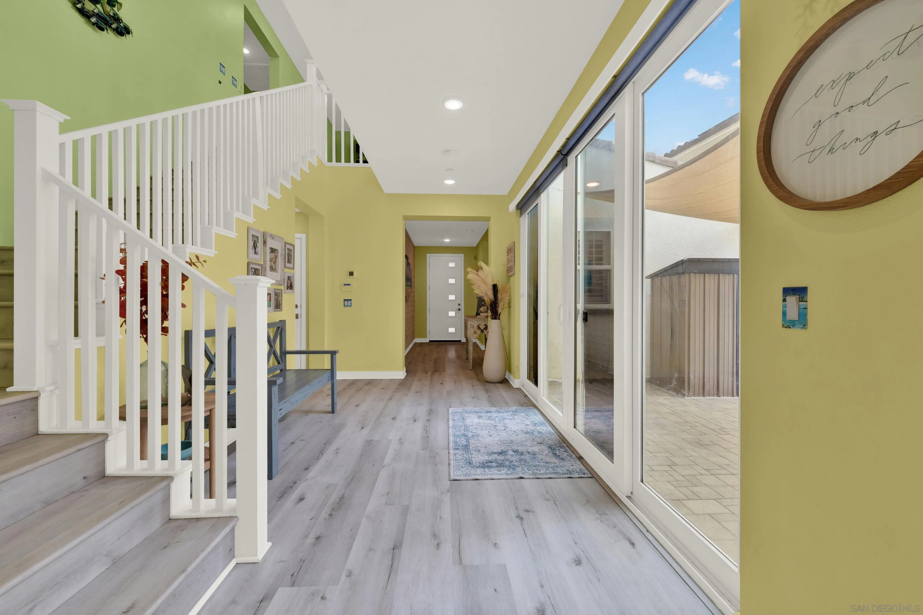 9108 West Bluff Place Santee, CA 92071 - Photo 24 of 72 a view of a hallway with wooden floor and entryway