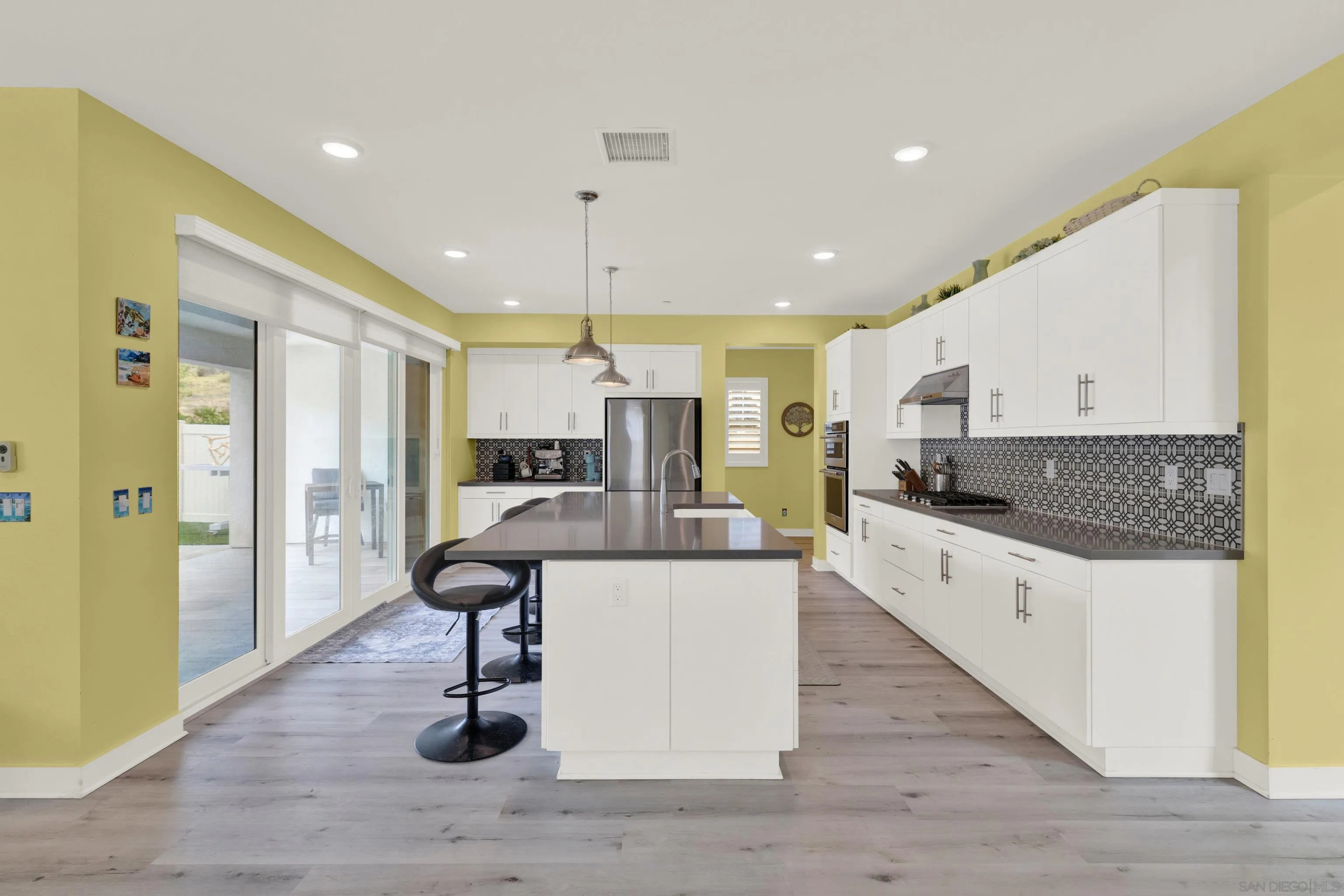 9108 West Bluff Place Santee, CA 92071 - Photo 31 of 72 a large kitchen with a table and chairs