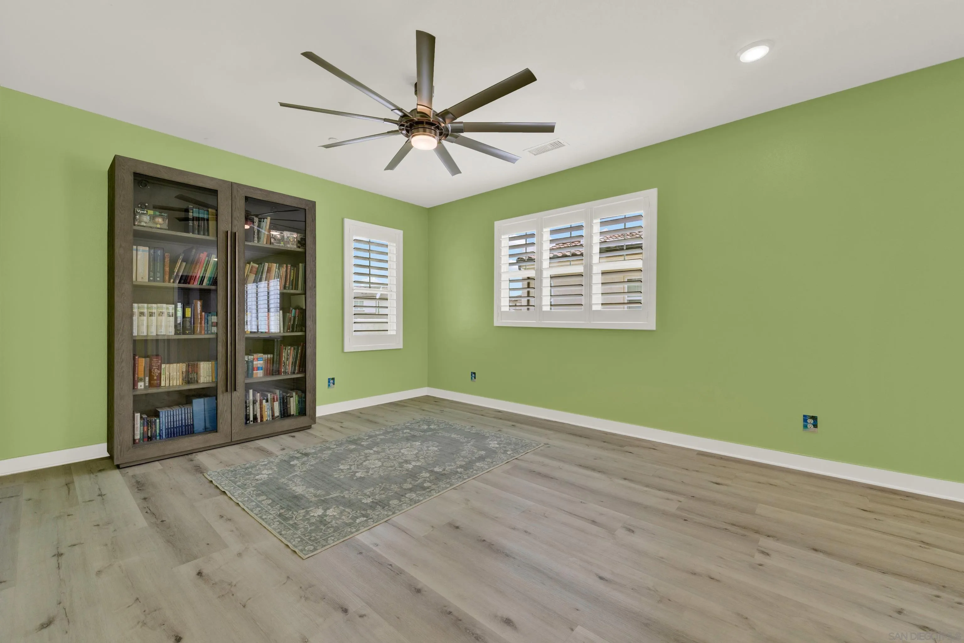 9108 West Bluff Place Santee, CA 92071 - Photo 41 of 72 a view of an empty room with a window and wooden floor