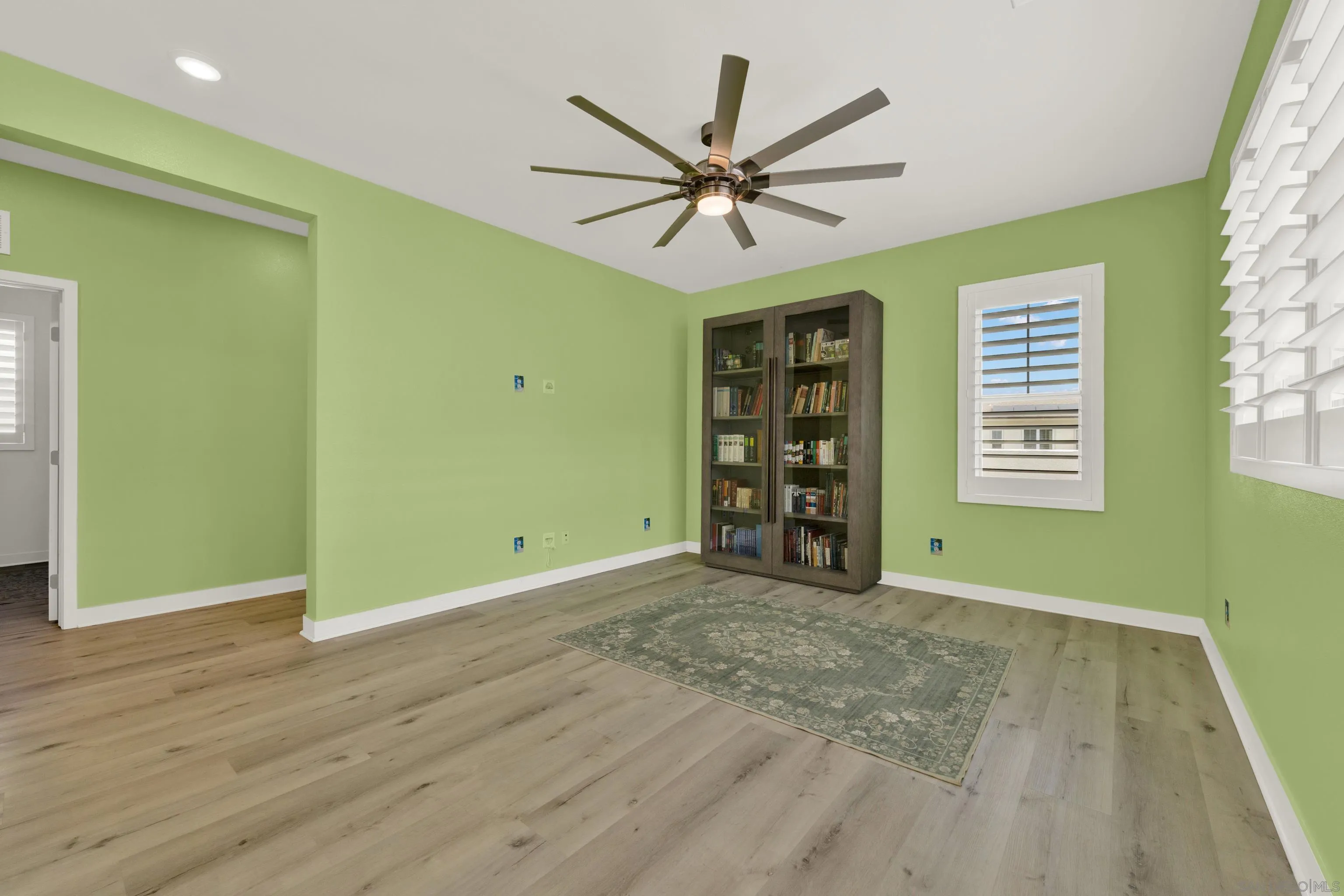 9108 West Bluff Place Santee, CA 92071 - Photo 42 of 72 a view of an empty room with a window and wooden floor