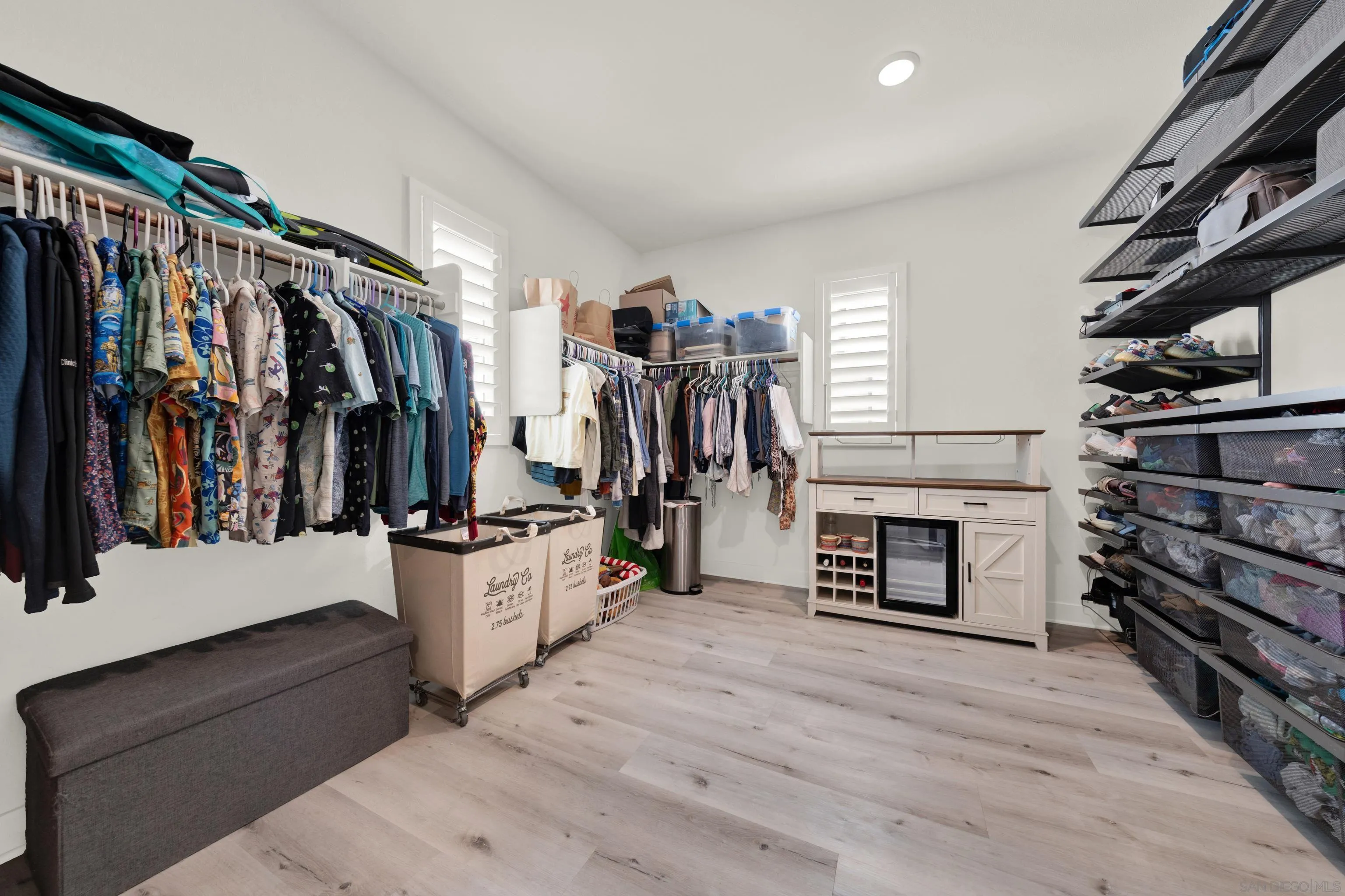 9108 West Bluff Place Santee, CA 92071 - Photo 52 of 72 a view of a walk in closet with clothes and shoes