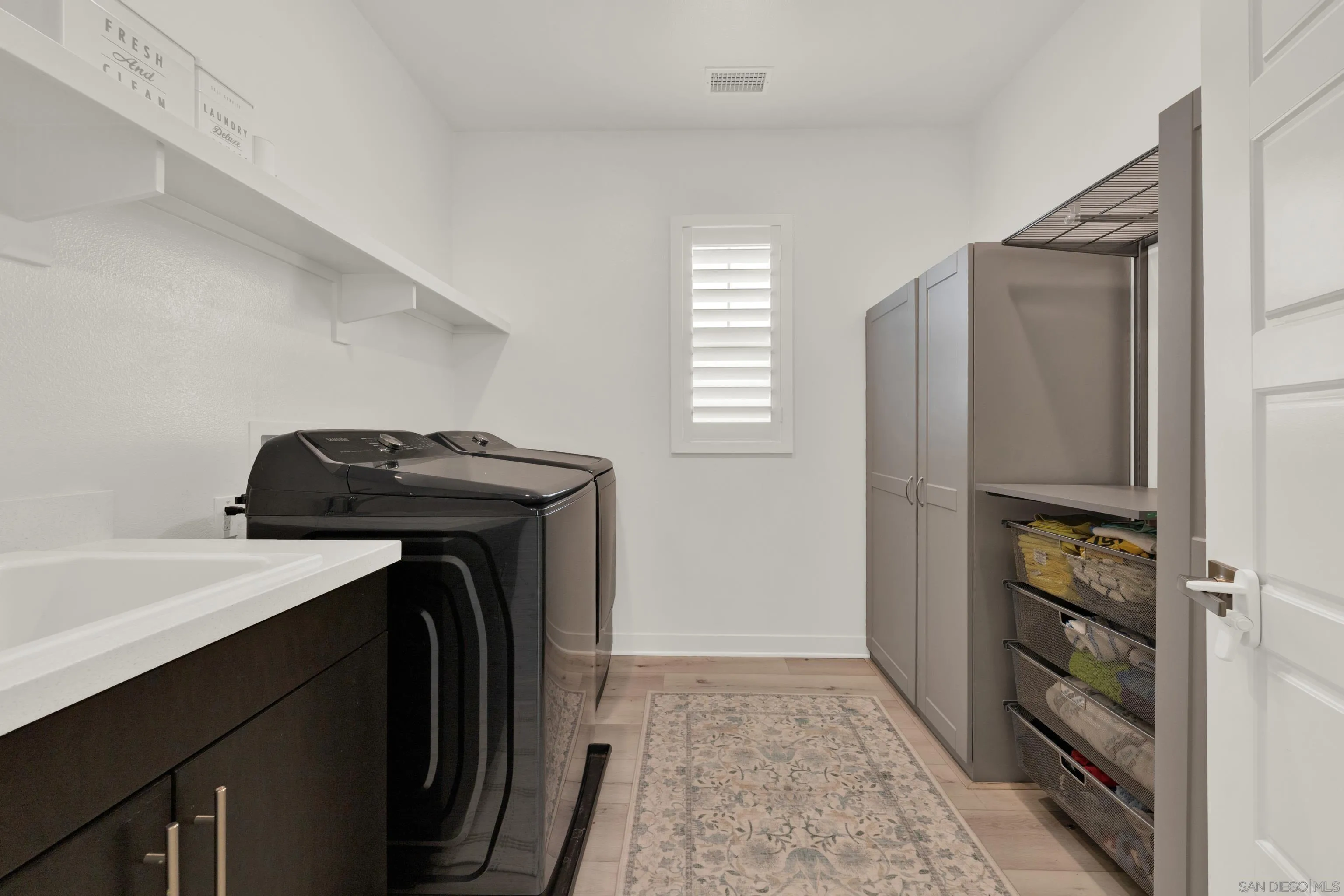 9108 West Bluff Place Santee, CA 92071 - Photo 58 of 72 a utility room with closet and windows