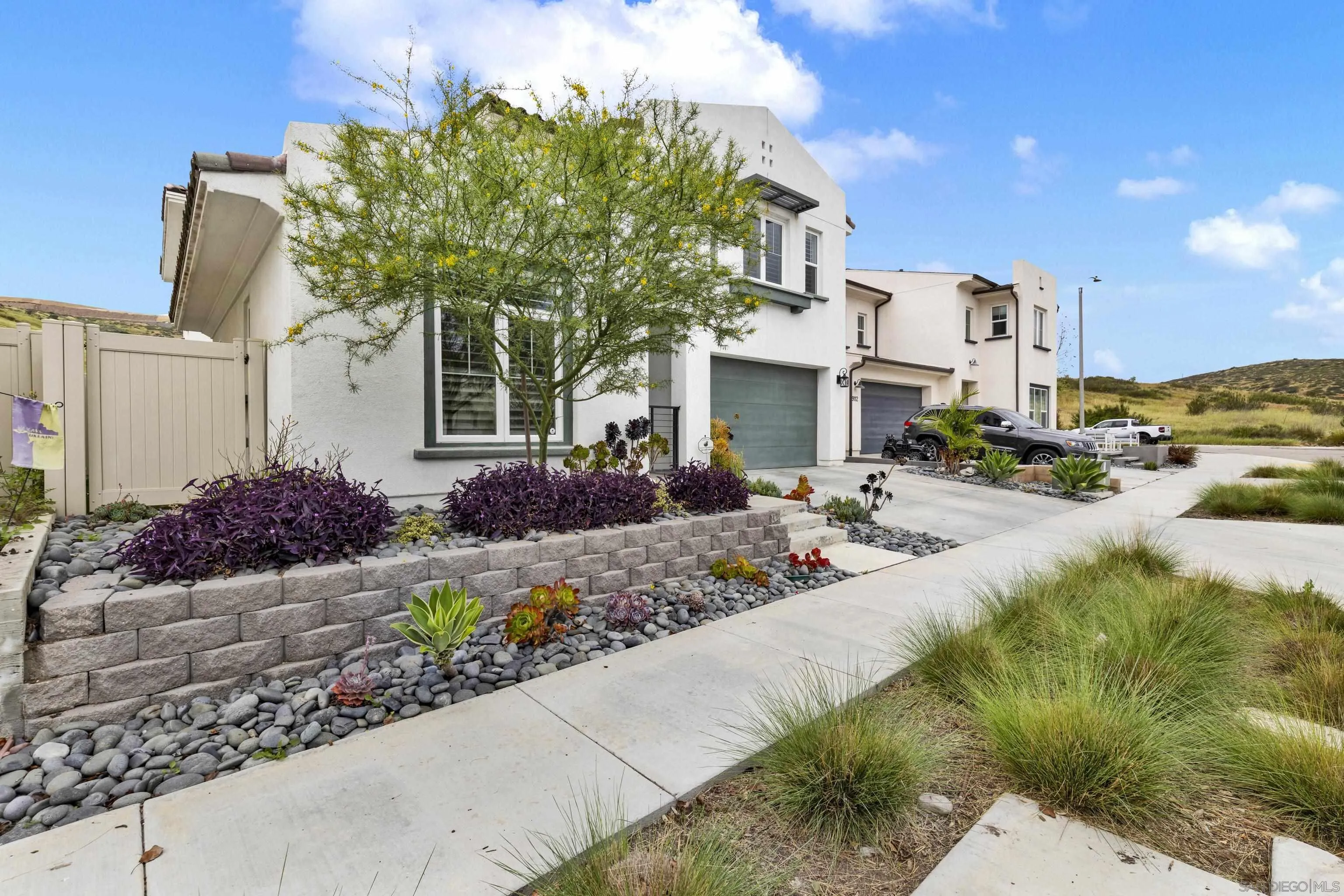 9108 West Bluff Place Santee, CA 92071 - Photo 7 of 72 a front view of a house with a yard