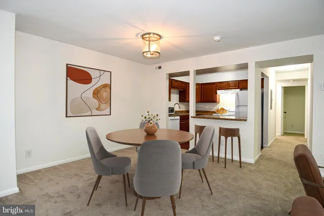 a view of a dining room with furniture and a livingroom