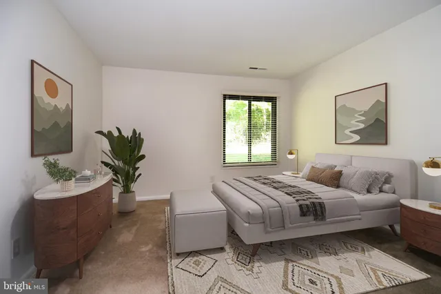 a bedroom with a bed and a couch