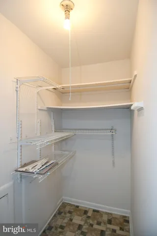 a view of walk in closet with window