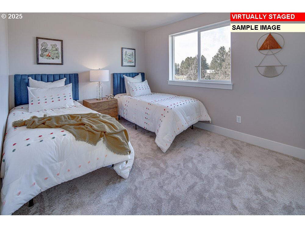 4532 South 39th Drive Ridgefield, WA 98642 - Photo 8 of 10 a bedroom with a bed and a window
