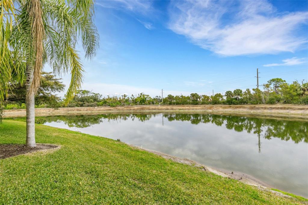 4284 Expedition Way Osprey, FL 34229 - Photo 17 of 40 a view of a lake with houses in the background
