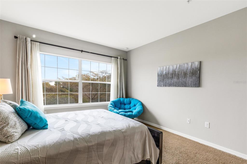 4284 Expedition Way Osprey, FL 34229 - Photo 20 of 40 a bedroom with a bed and a window