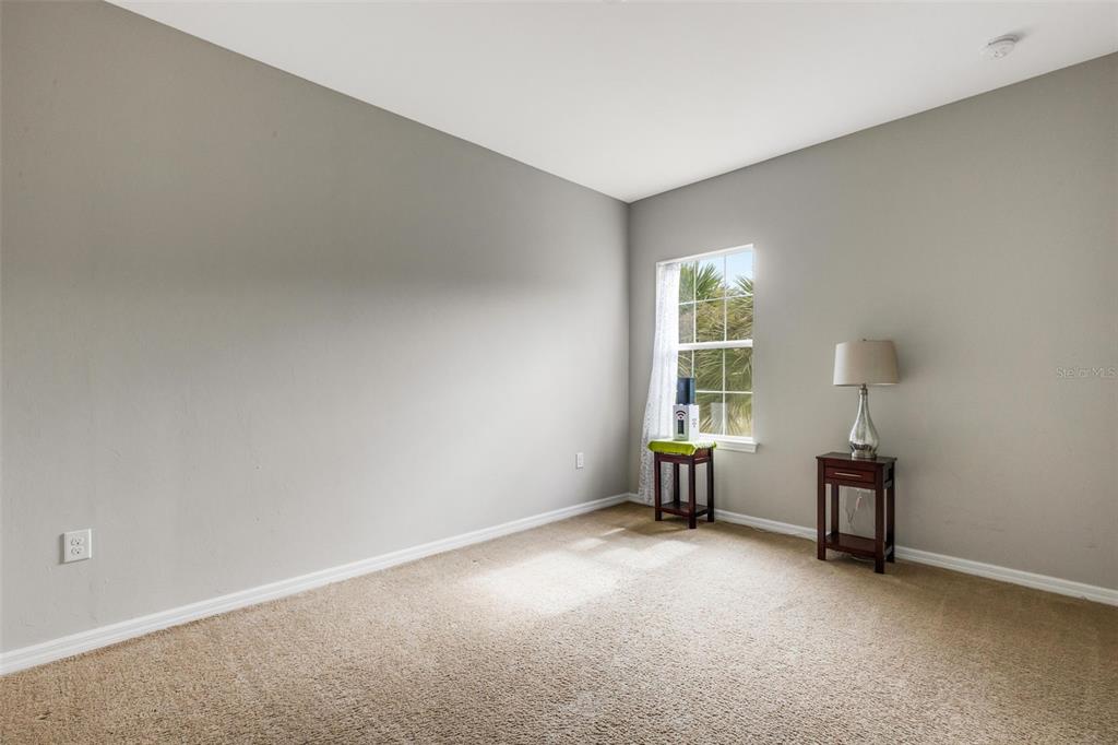 4284 Expedition Way Osprey, FL 34229 - Photo 25 of 40 an empty room with windows