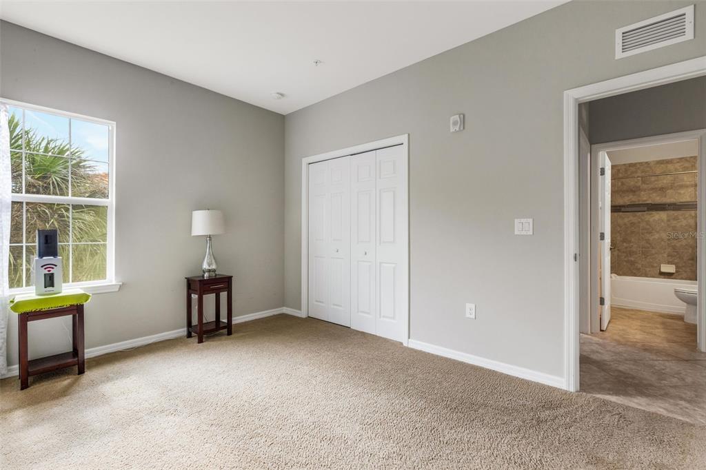 4284 Expedition Way Osprey, FL 34229 - Photo 26 of 40 an empty room with windows and closet