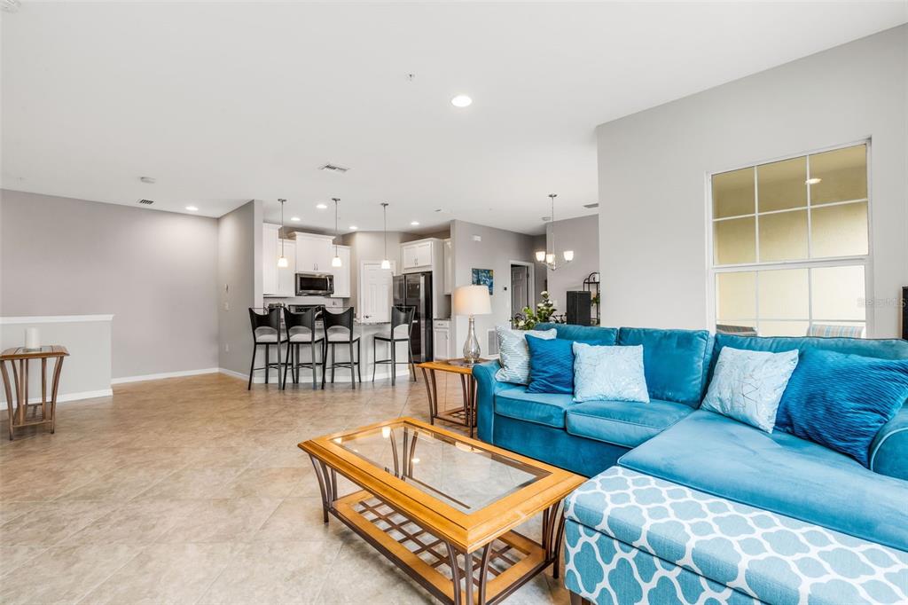 4284 Expedition Way Osprey, FL 34229 - Photo 5 of 40 a living room with furniture and kitchen view