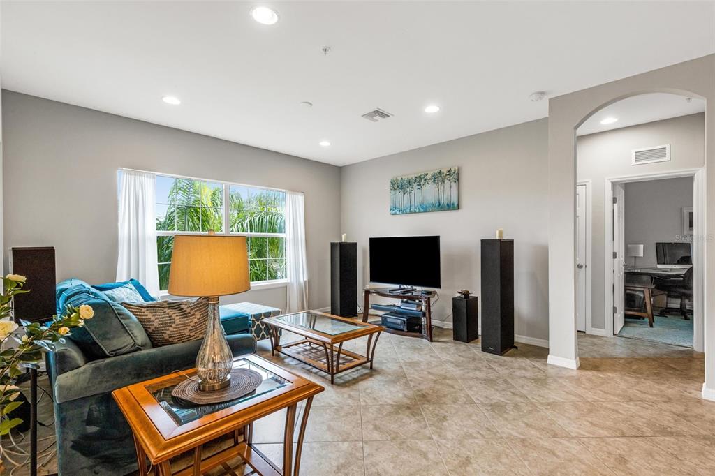 4284 Expedition Way Osprey, FL 34229 - Photo 6 of 40 a living room with furniture and a flat screen tv