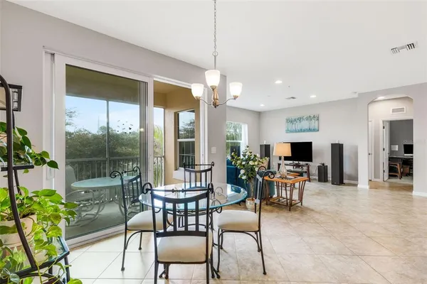 a dining room with furniture garden view and a potted plants