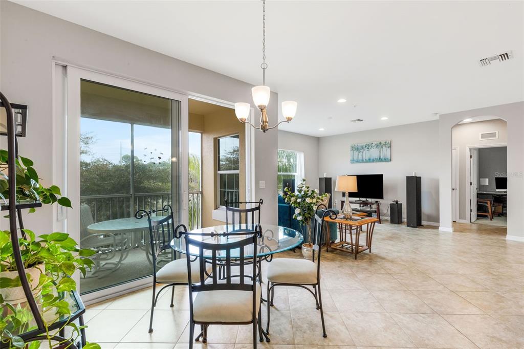 4284 Expedition Way Osprey, FL 34229 - Photo 8 of 40 a dining room with furniture garden view and a potted plants