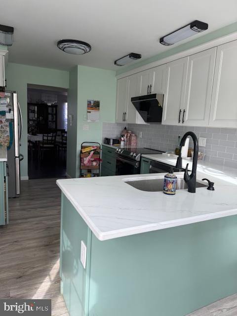 3 Owl Court Marlton, NJ 08053 - Photo 16 of 29 a kitchen with a sink a stove and cabinets