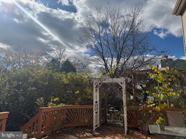 3 Owl Court Marlton, NJ 08053 - Photo 22 of 29 a view of a roof deck with table and chairs and wooden fence