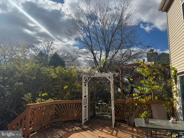 a bedroom with a bed couch and window