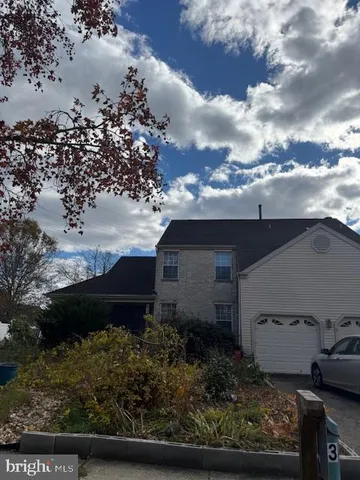 a view of a house with a garden