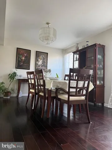 a kitchen with stainless steel appliances granite countertop a sink a stove and cabinets