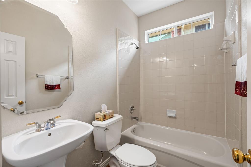 2012 Burnside Drive Allen, TX 75013 - Photo 22 of 40 a bathroom with a sink toilet and shower
