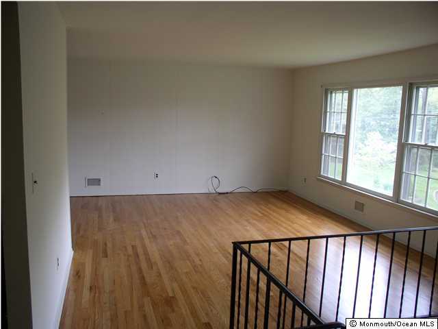 1303 Wedgewood Road Spring Lake, NJ 07762 - Photo 3 of 3 a view of wooden floor and window in a room