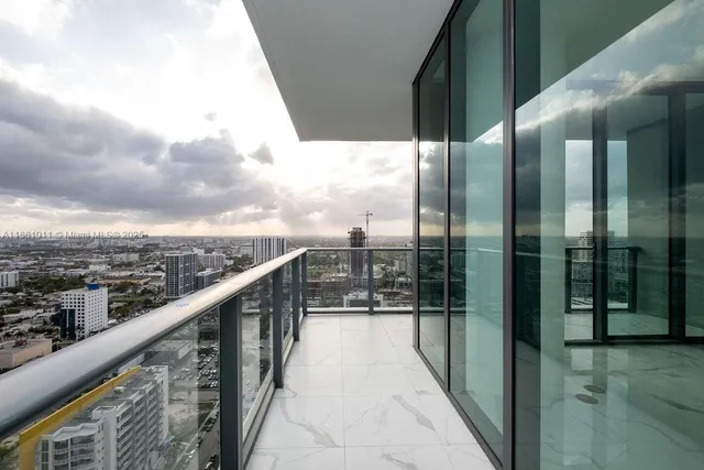 a view of empty room with floor to ceiling window