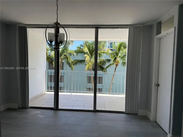 a kitchen with granite countertop a sink stainless steel appliances and cabinets